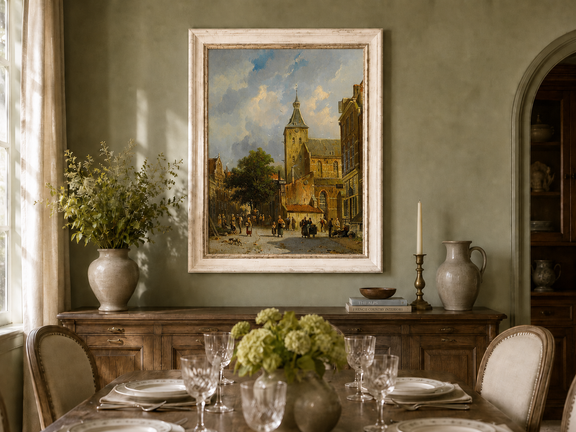Town square with church and figures oil landscape artwork shown in a styled home interior.