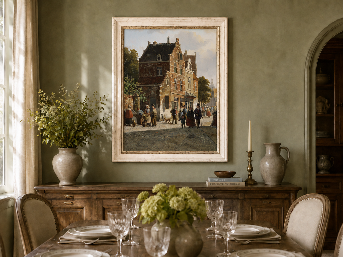 Town street with figures and historic buildings oil landscape artwork shown in a styled home interior.