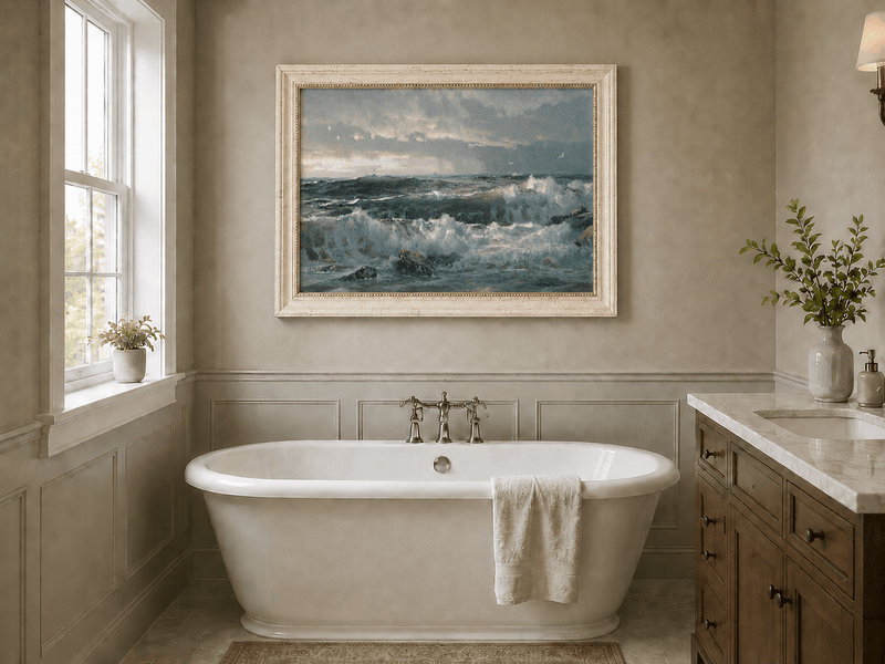 Framed hand-painted turbulent ocean oil painting with stormy waves and a distant vessel displayed above a freestanding bathtub.