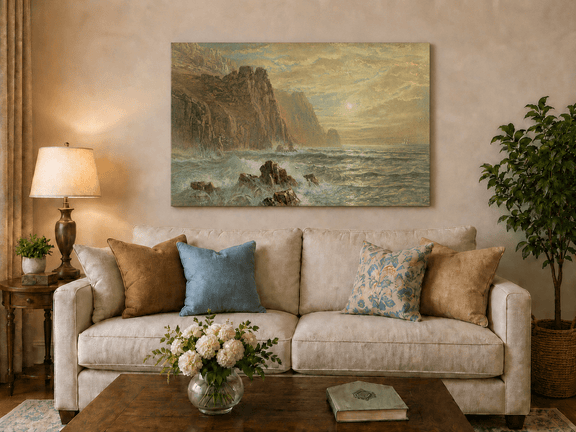 Unframed hand-painted seascape oil painting with wave-washed rocks beneath soft-hued skies displayed above a neutral living room sofa.