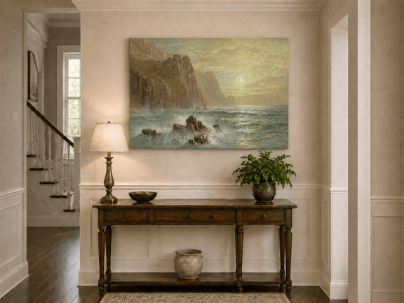Unframed hand-painted seascape oil painting with wave-washed rocks beneath soft-hued skies displayed above an entryway console table.