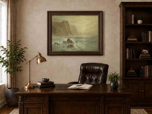Framed hand-painted seascape oil painting with wave-washed rocks beneath soft-hued skies displayed above a traditional home office desk.