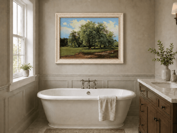 Framed hand-painted meadow oil painting with trees and small figures displayed above a freestanding bathtub.