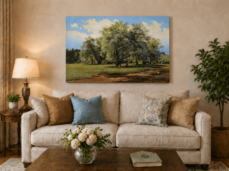 Unframed hand-painted meadow oil painting with trees and small figures displayed above a neutral living room sofa.
