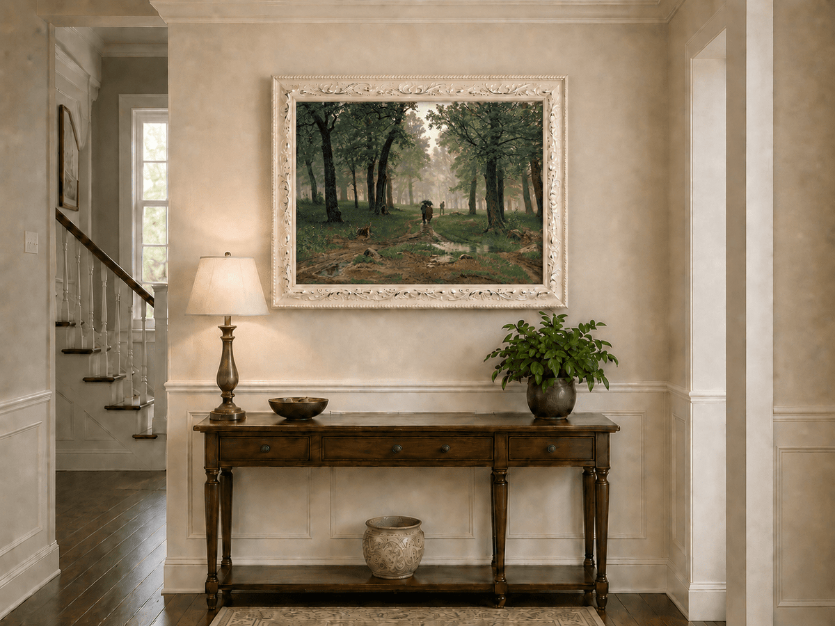 Framed hand-painted misty forest path oil painting with figures among tall trees displayed above an entryway console table.