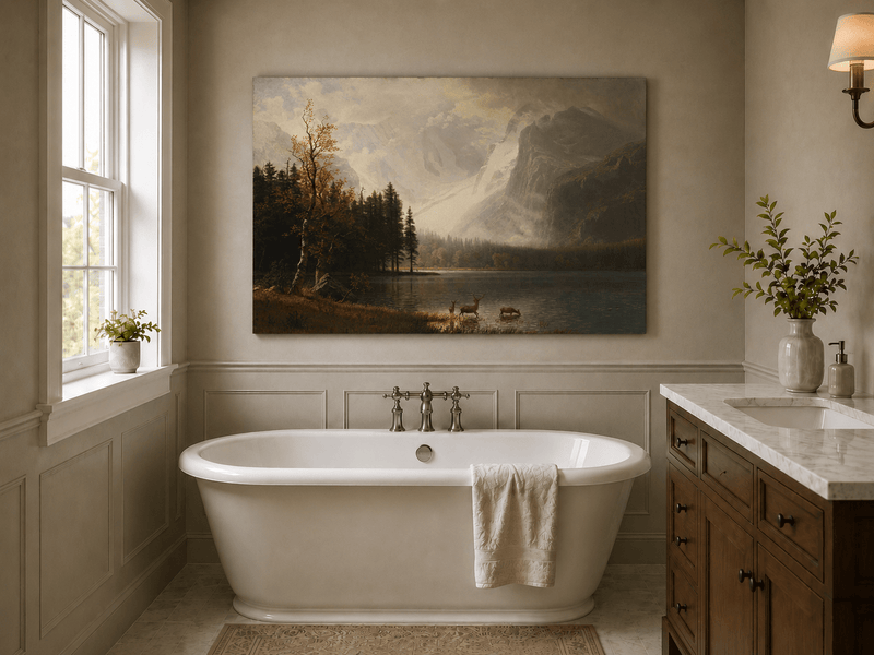 Unframed hand-painted mountain lake oil painting with a deer herd and autumn trees displayed above a freestanding bathtub.