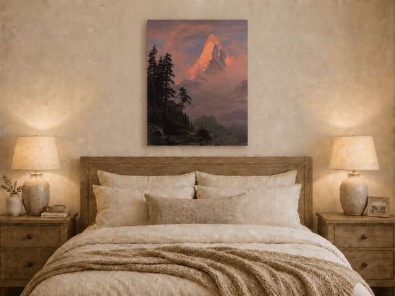 Unframed hand-painted mountain oil painting with a sunlit peak, dark forest and mist displayed above a wooden bed in a neutral bedroom.