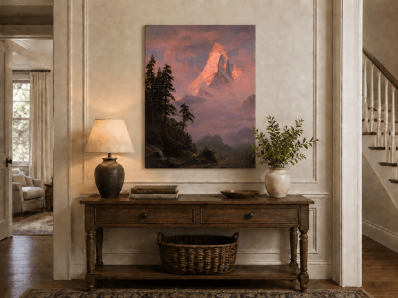 Unframed hand-painted mountain oil painting with a sunlit peak, dark forest and mist displayed above an entryway console table.