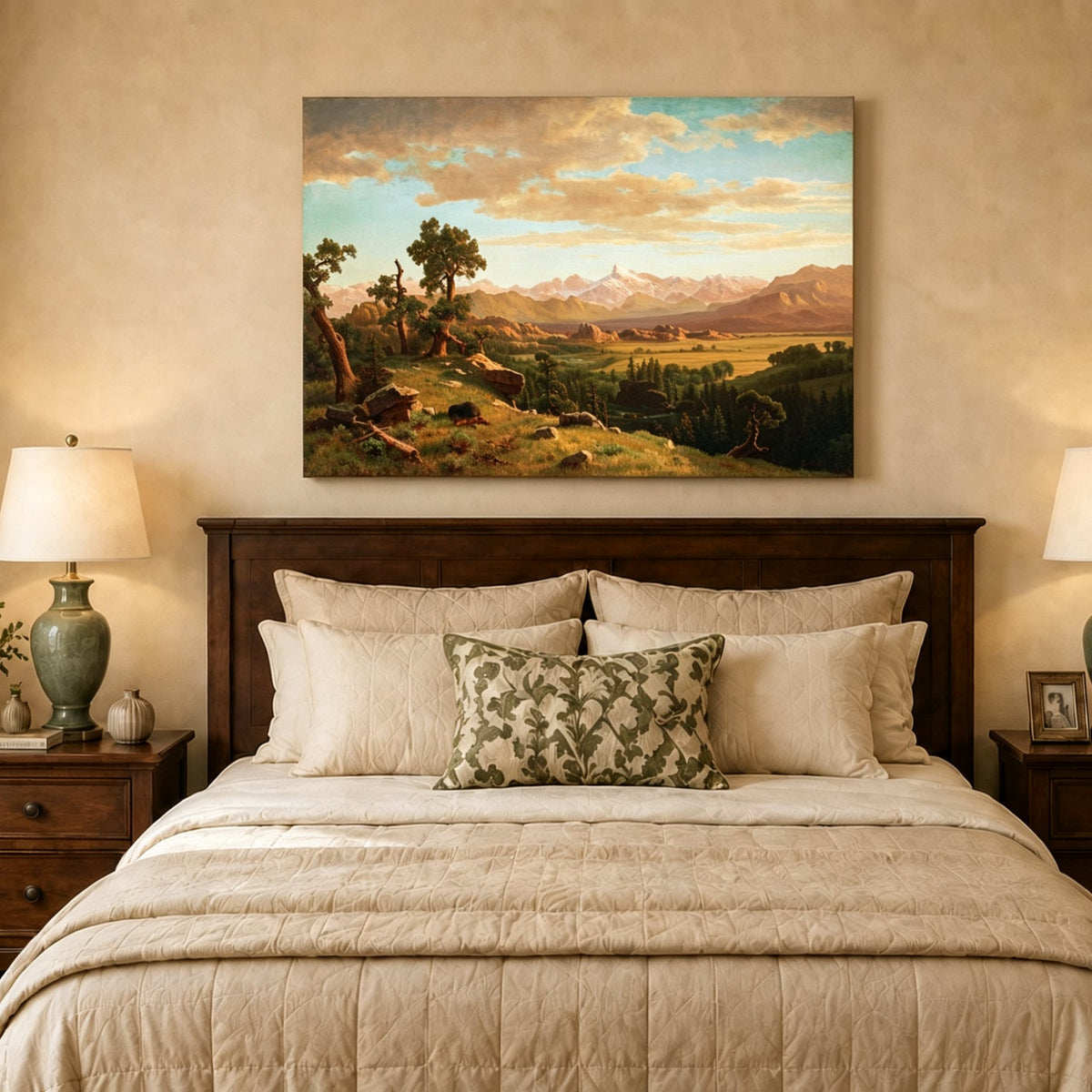 Unframed hand-painted mountain valley panorama with golden hills and distant peaks displayed above a wooden bed in a neutral bedroom.