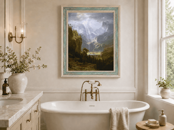Framed hand-painted mountain valley oil painting with a waterfall and lake displayed above a freestanding bathtub.