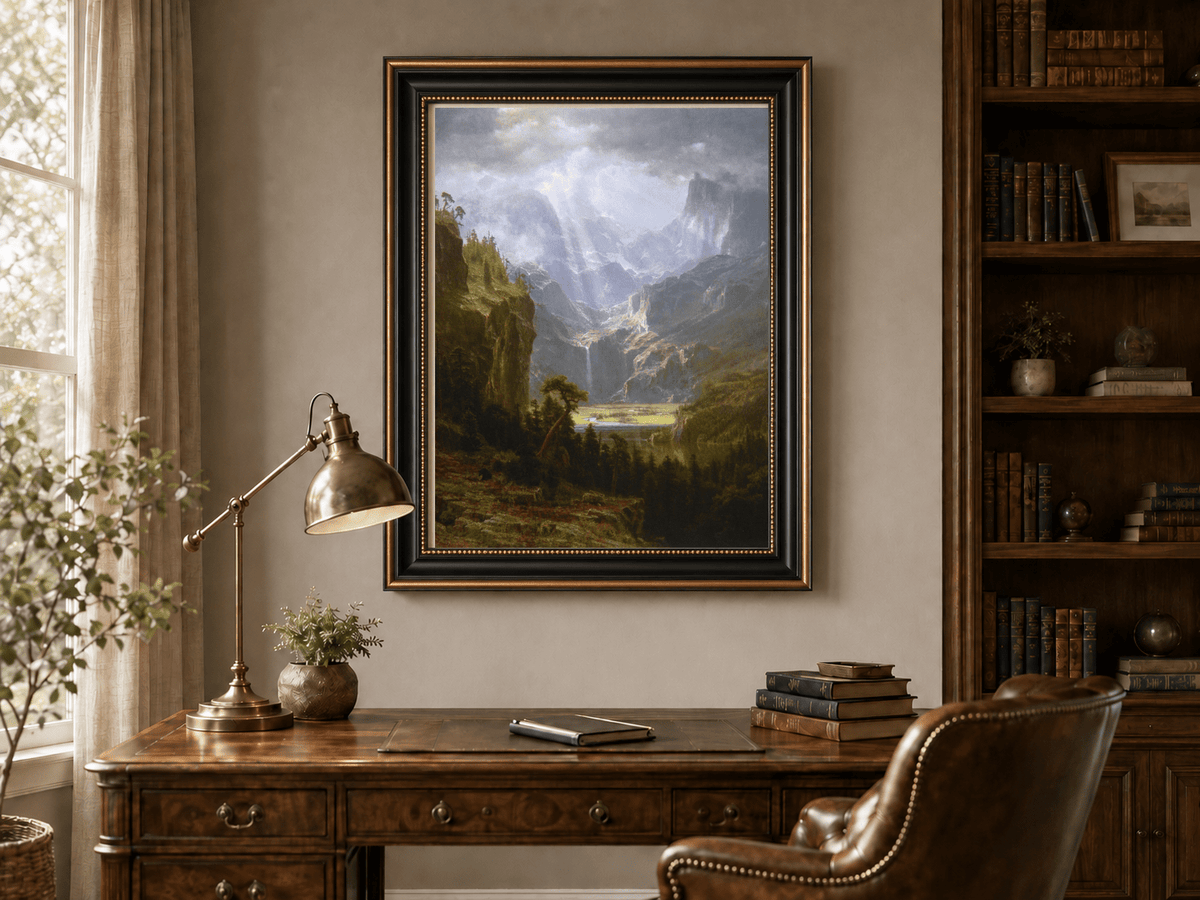 Framed hand-painted mountain valley oil painting with a waterfall and lake displayed above a traditional home office desk.