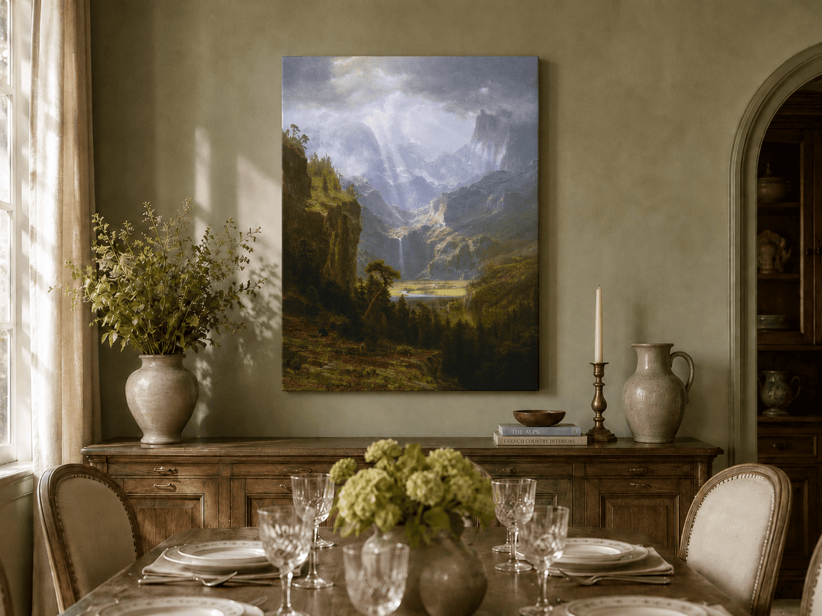 Unframed hand-painted mountain valley oil painting with a waterfall and lake displayed above a formal dining table.