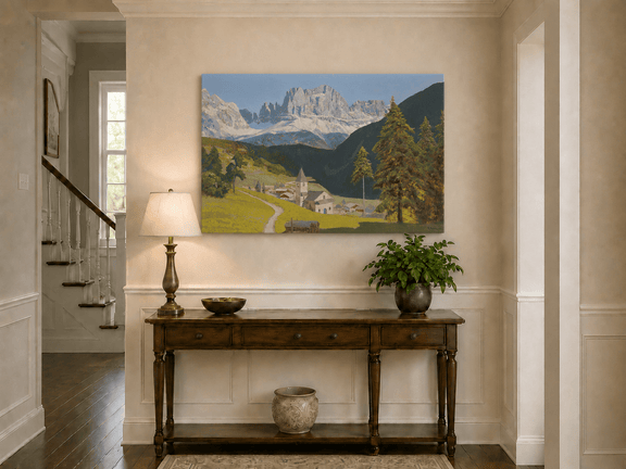 Unframed hand-painted alpine landscape oil painting with a mountain village, church and path displayed above an entryway console table.
