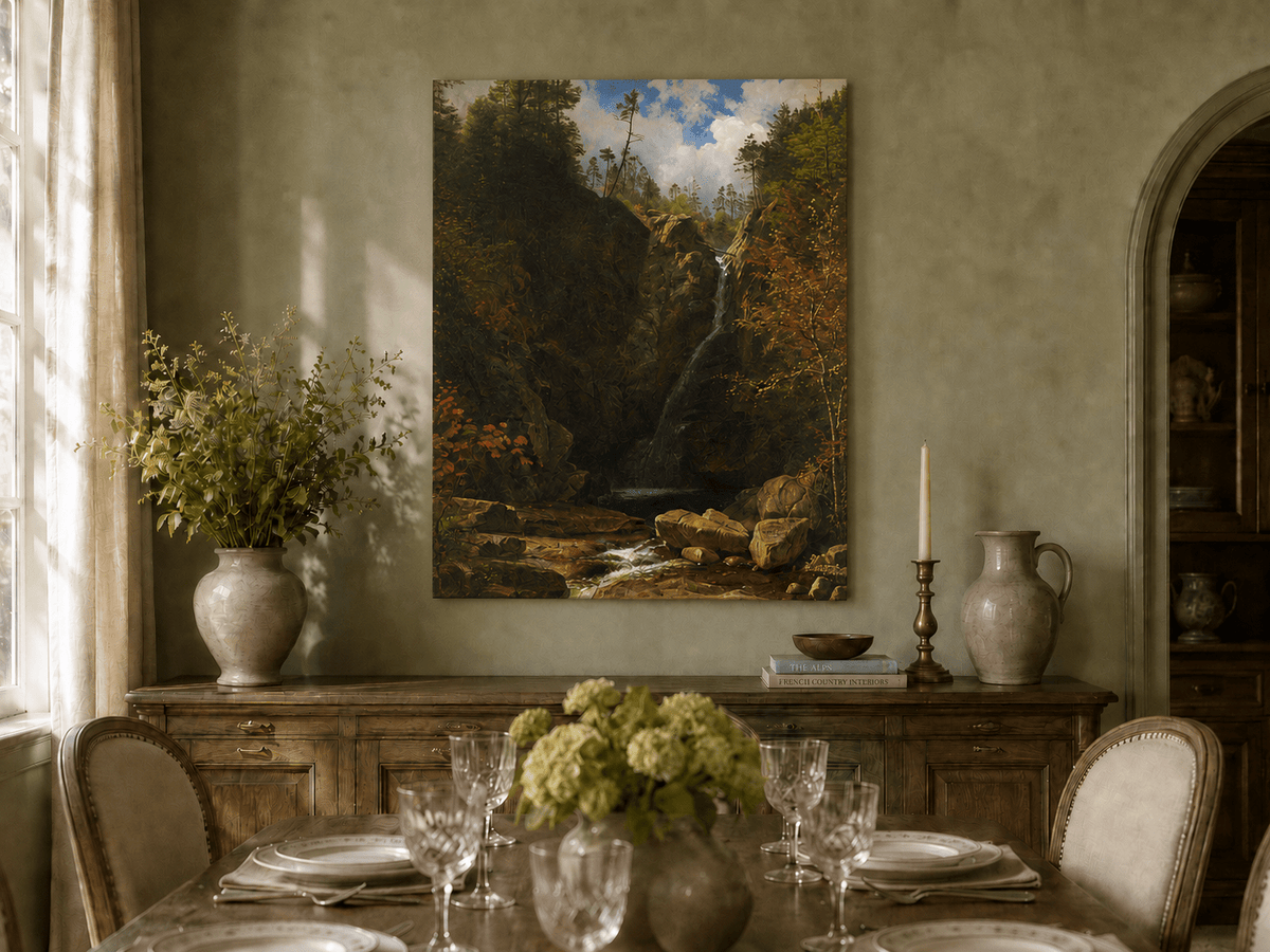 Unframed hand-painted mountain waterfall oil painting through a dark autumn forest displayed above a formal dining table.