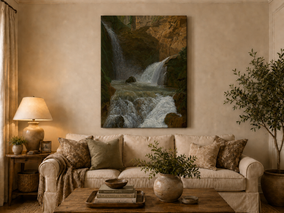 Hand-painted mountain waterfall in a rocky gorge landscape oil painting displayed above a sofa in a living room interior.