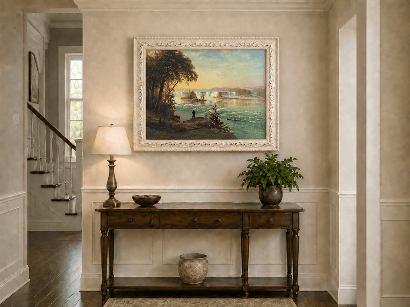 Framed hand-painted Niagara Falls oil painting with figures near the riverbank displayed above an entryway console table.