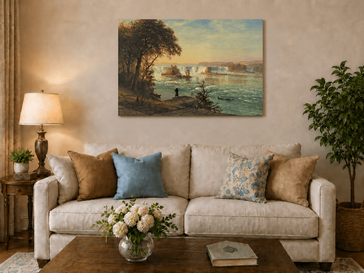 Unframed hand-painted Niagara Falls oil painting with figures near the riverbank displayed above a neutral living room sofa.