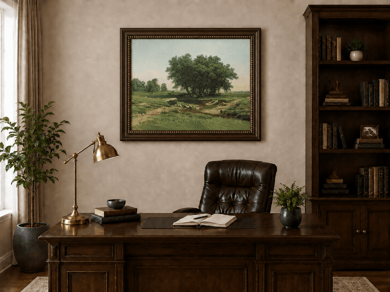 Framed hand-painted pastoral landscape oil painting with broad trees and a winding stream displayed above a traditional home office desk.