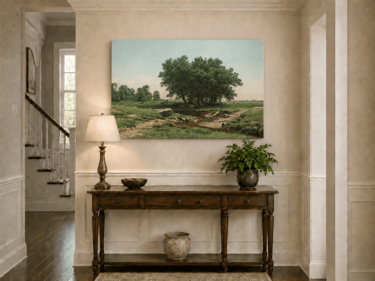Unframed hand-painted pastoral landscape oil painting with broad trees and a winding stream displayed above an entryway console table.