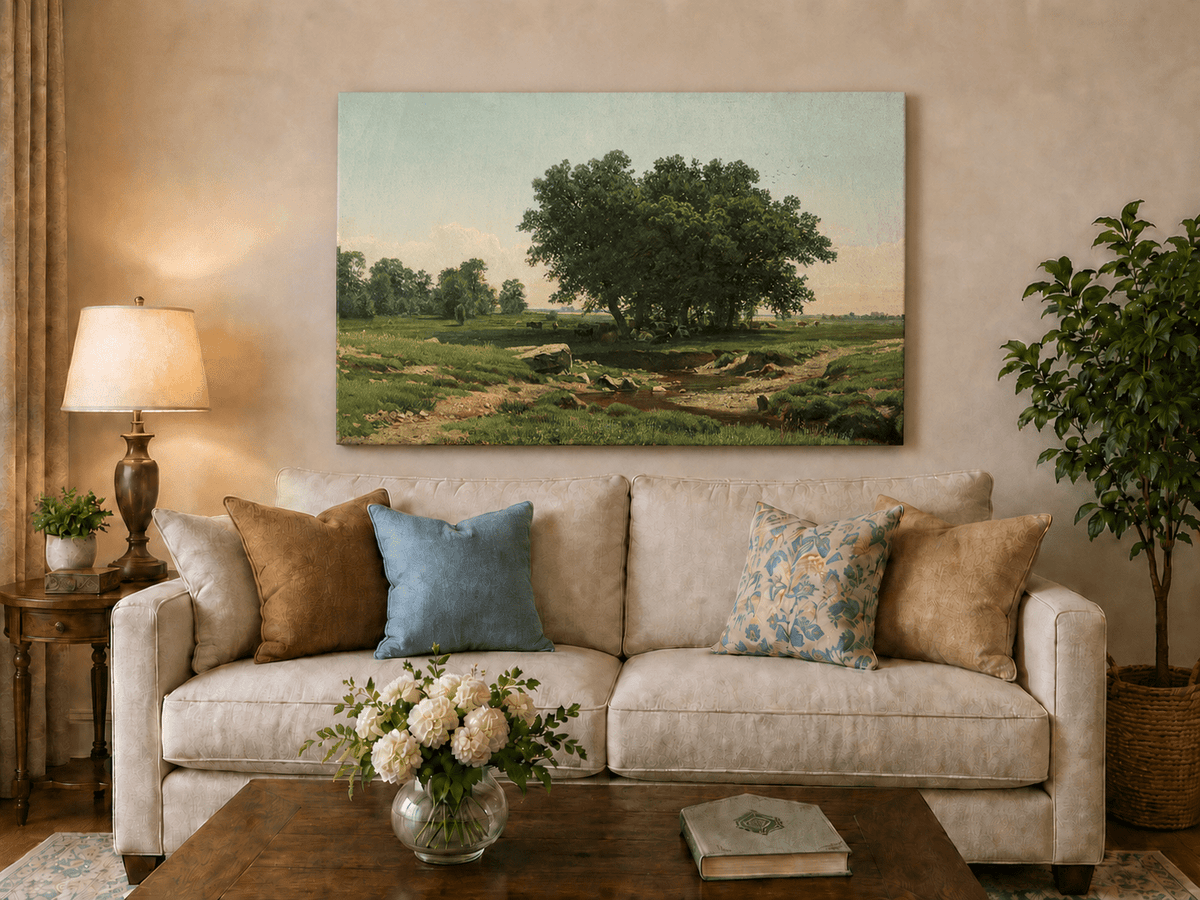 Unframed hand-painted pastoral landscape oil painting with broad trees and a winding stream displayed above a neutral living room sofa.