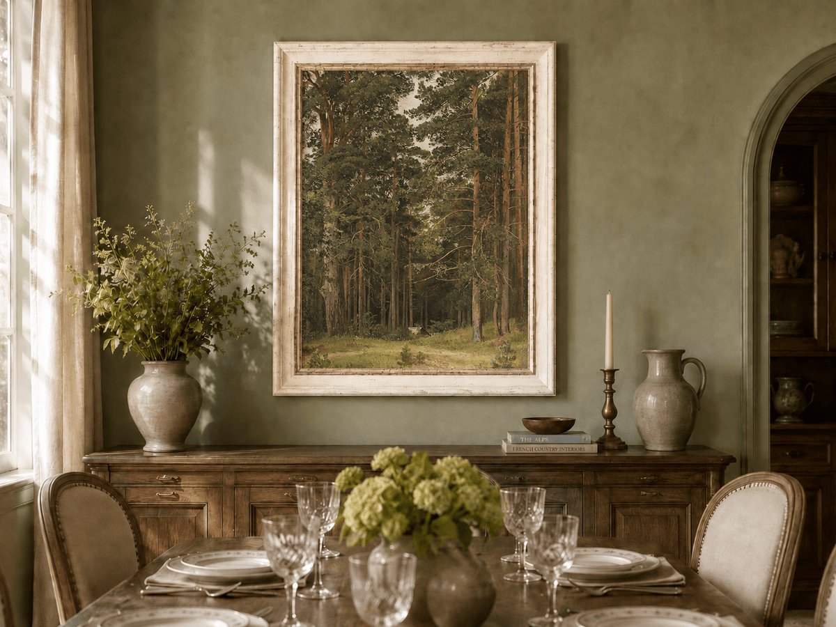 Framed hand-painted pine forest oil painting with a woodland path and secluded cabin displayed above a formal dining table.