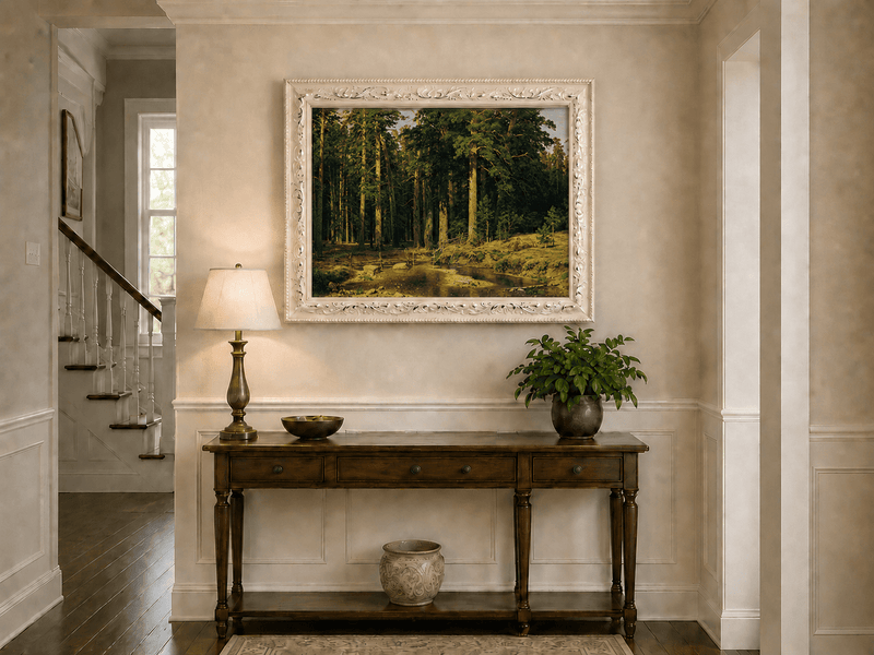 Framed hand-painted pine forest oil painting with a stream and rustic wooden bridge displayed above an entryway console table.