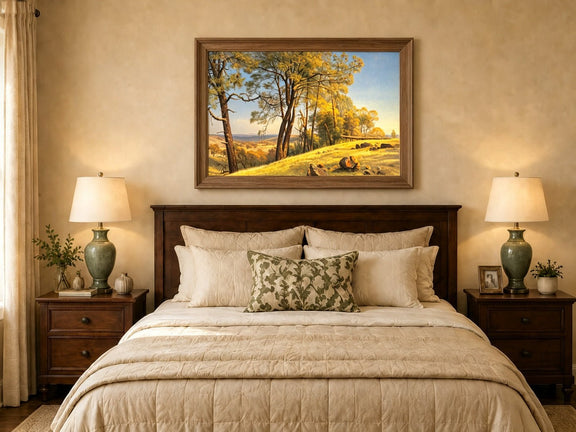 Framed hand-painted pine tree landscape oil painting on a bright sunlit hill displayed above a wooden bed in a neutral bedroom.