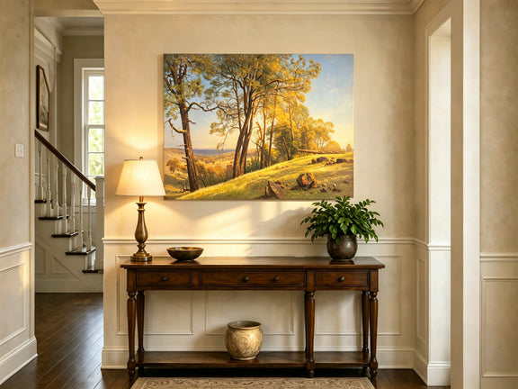 Unframed hand-painted pine tree landscape oil painting on a bright sunlit hill displayed above an entryway console table.