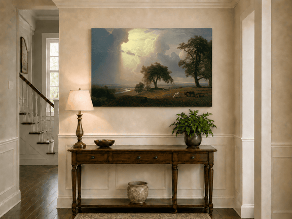 Unframed hand-painted prairie oil painting with cattle beneath dramatic sunbeams displayed above an entryway console table.