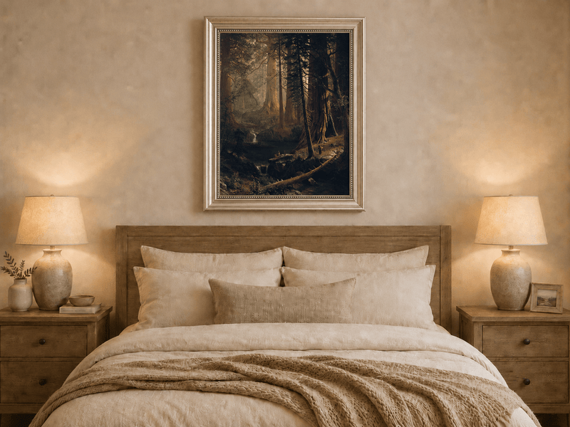 Framed hand-painted redwood forest oil painting with towering trees and filtered light displayed above a wooden bed in a neutral bedroom.