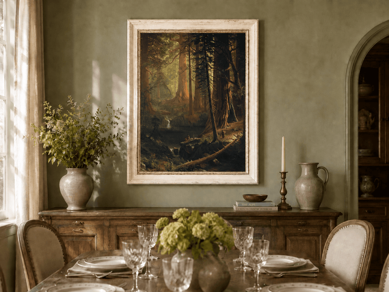Framed hand-painted redwood forest oil painting with towering trees and filtered light displayed above a formal dining table.