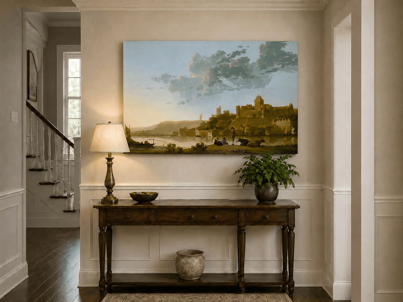 Unframed hand-painted riverside castle town oil painting with fishermen at sunset displayed above an entryway console table.
