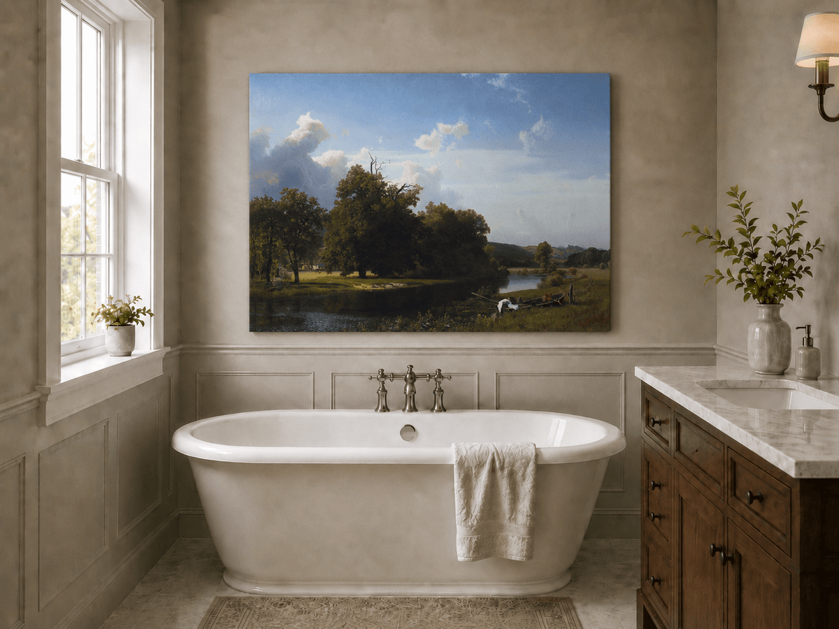 Unframed hand-painted riverside oil painting with a large oak tree, boat and distant cottage displayed above a freestanding bathtub.