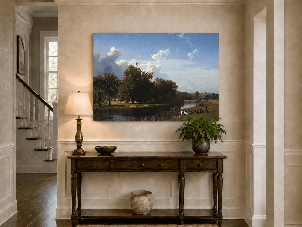 Unframed hand-painted riverside oil painting with a large oak tree, boat and distant cottage displayed above an entryway console table.
