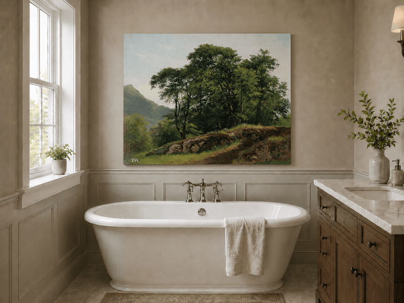 Unframed hand-painted landscape oil painting with a rocky hillside, oak tree and distant mountains displayed above a freestanding bathtub.