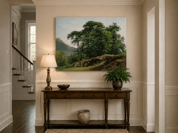 Unframed hand-painted landscape oil painting with a rocky hillside, oak tree and distant mountains displayed above an entryway console table.