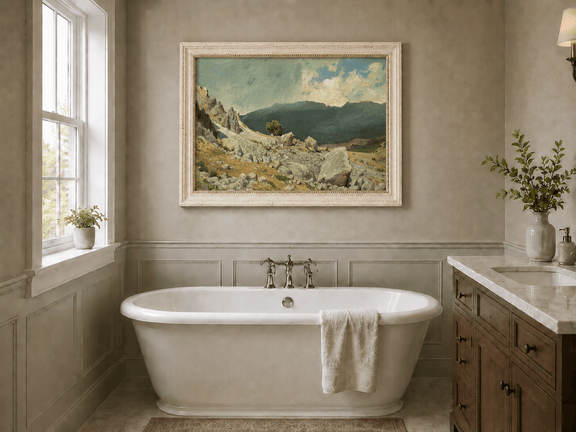 Framed hand-painted alpine oil painting with a rocky slope and distant mountain peaks displayed above a freestanding bathtub.