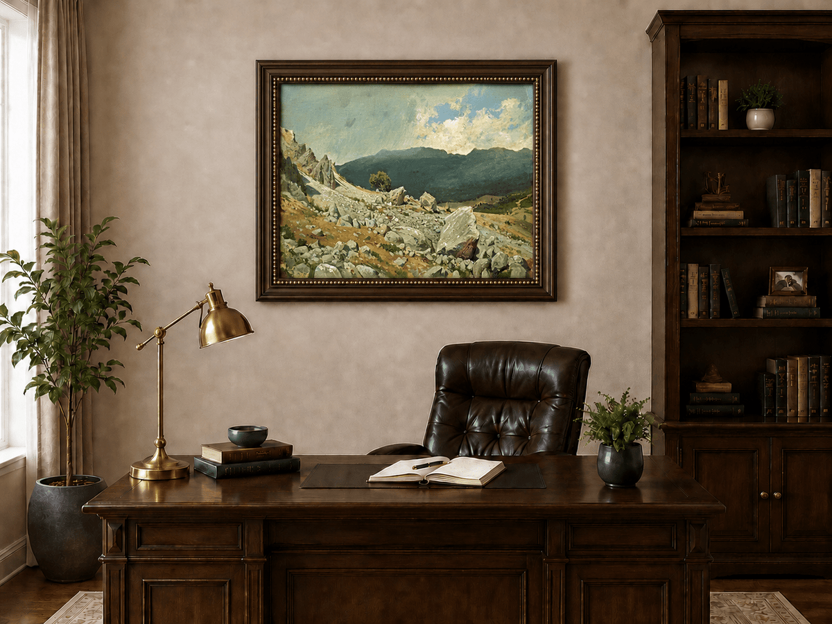 Framed hand-painted alpine oil painting with a rocky slope and distant mountain peaks displayed above a traditional home office desk.