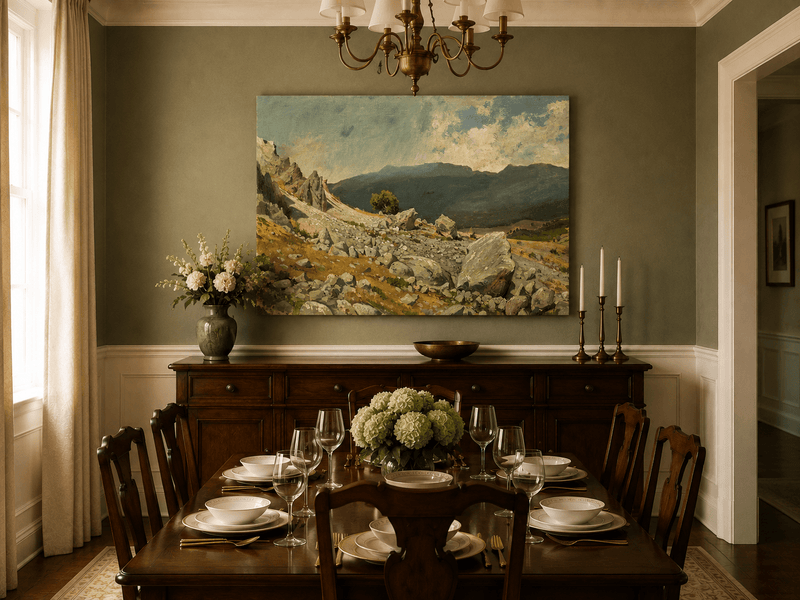 Unframed hand-painted alpine oil painting with a rocky slope and distant mountain peaks displayed above a formal dining table.