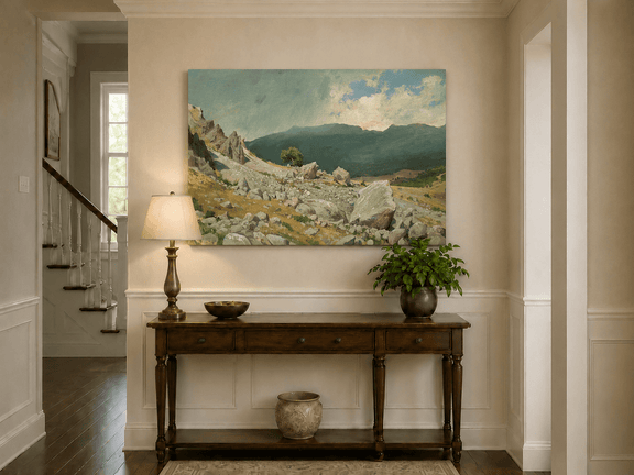 Unframed hand-painted alpine oil painting with a rocky slope and distant mountain peaks displayed above an entryway console table.