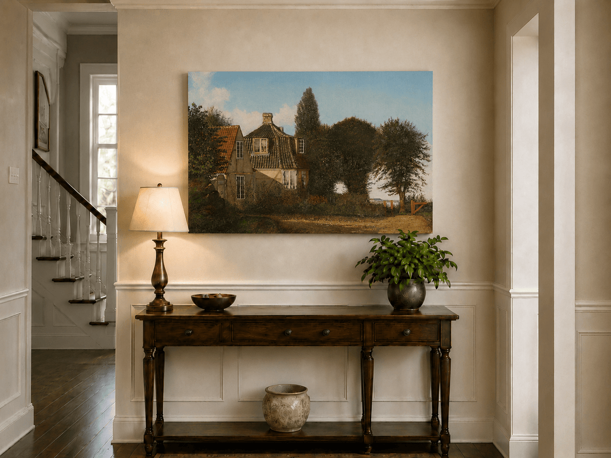 Unframed hand-painted rural cottage oil painting with half-timbered walls, tiled roofs and trees displayed above an entryway console table.