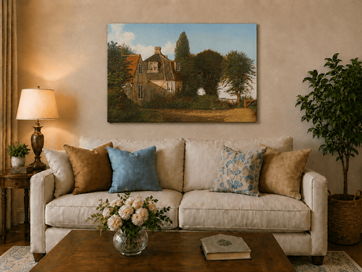 Unframed hand-painted rural cottage oil painting with half-timbered walls, tiled roofs and trees displayed above a neutral living room sofa.
