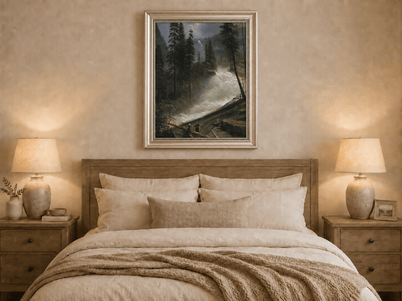 Framed hand-painted forest oil painting with figures beside a rushing river and waterfall displayed above a wooden bed in a neutral bedroom.