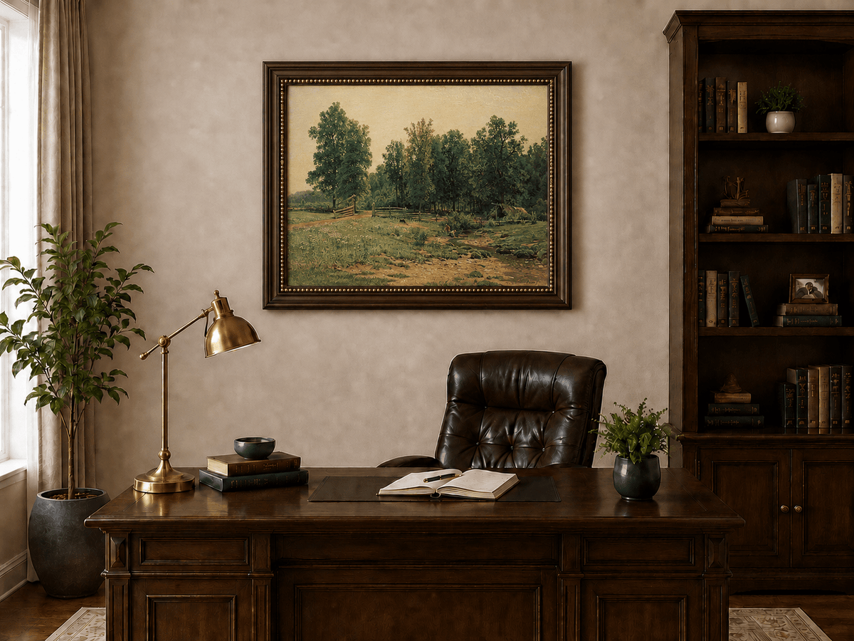 Framed hand-painted rustic meadow oil painting with a stream and distant forest edge displayed above a traditional home office desk.