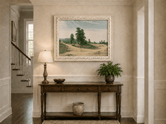 Framed hand-painted sandy forest clearing oil painting with a distant figure displayed above an entryway console table.
