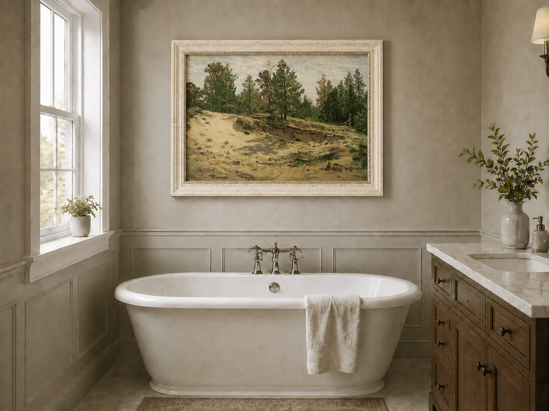 Framed hand-painted sandy forest clearing oil painting with scattered pines and open ground displayed above a freestanding bathtub.
