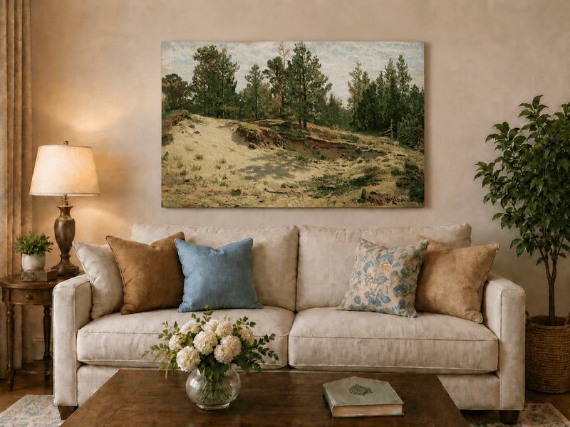 Unframed hand-painted sandy forest clearing oil painting with scattered pines and open ground displayed above a neutral living room sofa.