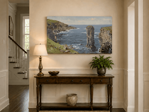 Unframed hand-painted coastal oil painting with sea stacks, cliffs and churning ocean waves displayed above an entryway console table.