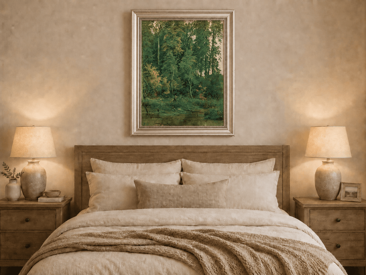 Framed hand-painted serene forest pond oil painting with leafy trees and still water displayed above a wooden bed in a neutral bedroom.
