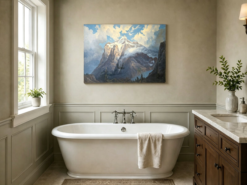 Unframed hand-painted snow-capped mountain oil painting rising through luminous mist displayed above a freestanding bathtub.